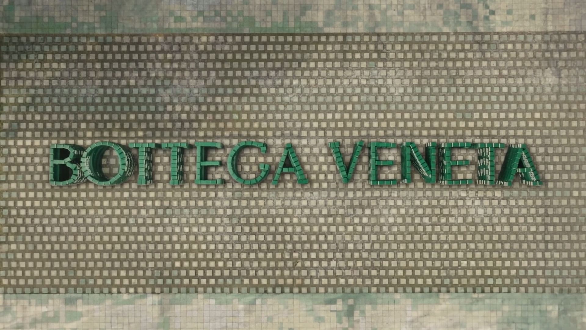 Ação com o logo - The Book logo da Bottega Veneta